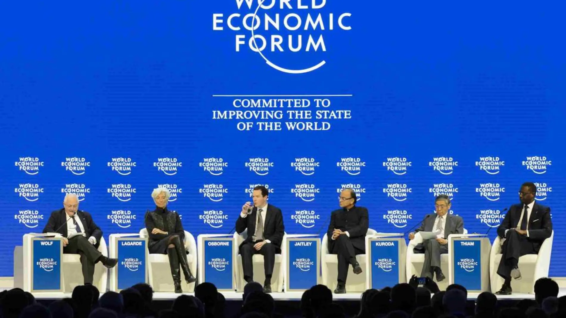 La directora gerente del FMI, Christine Lagarde; el consejero delegado del Credit Suisse, Tidjane Thiam, o el gobernador del Banco Central de Japón, Haruhiko Kuroda, en una jornada del Foro Davos.