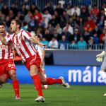 Domínguez celebra su gol junto al Kun