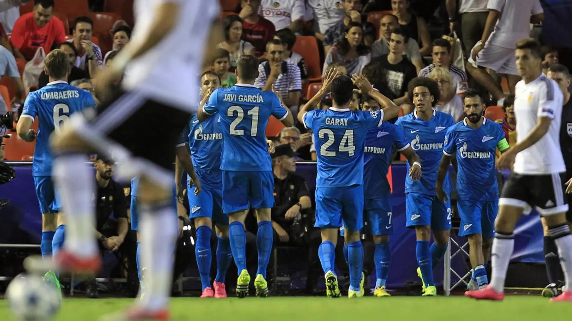 Zenit's Hulk, background third right, celebrates after scoring against Valencia during a Group H Champions League soccer match between Valencia and Zenit Saint Petersburg, at the Mestalla stadium in Valencia, Spain, Wednesday, Sept. 16, 2015. (AP Photo/Alberto Saiz)