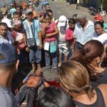 Un hombre yace muerto en una calle en San Félix, en el estado de Bolívar, tras un saqueo en un mercado, el año pasado