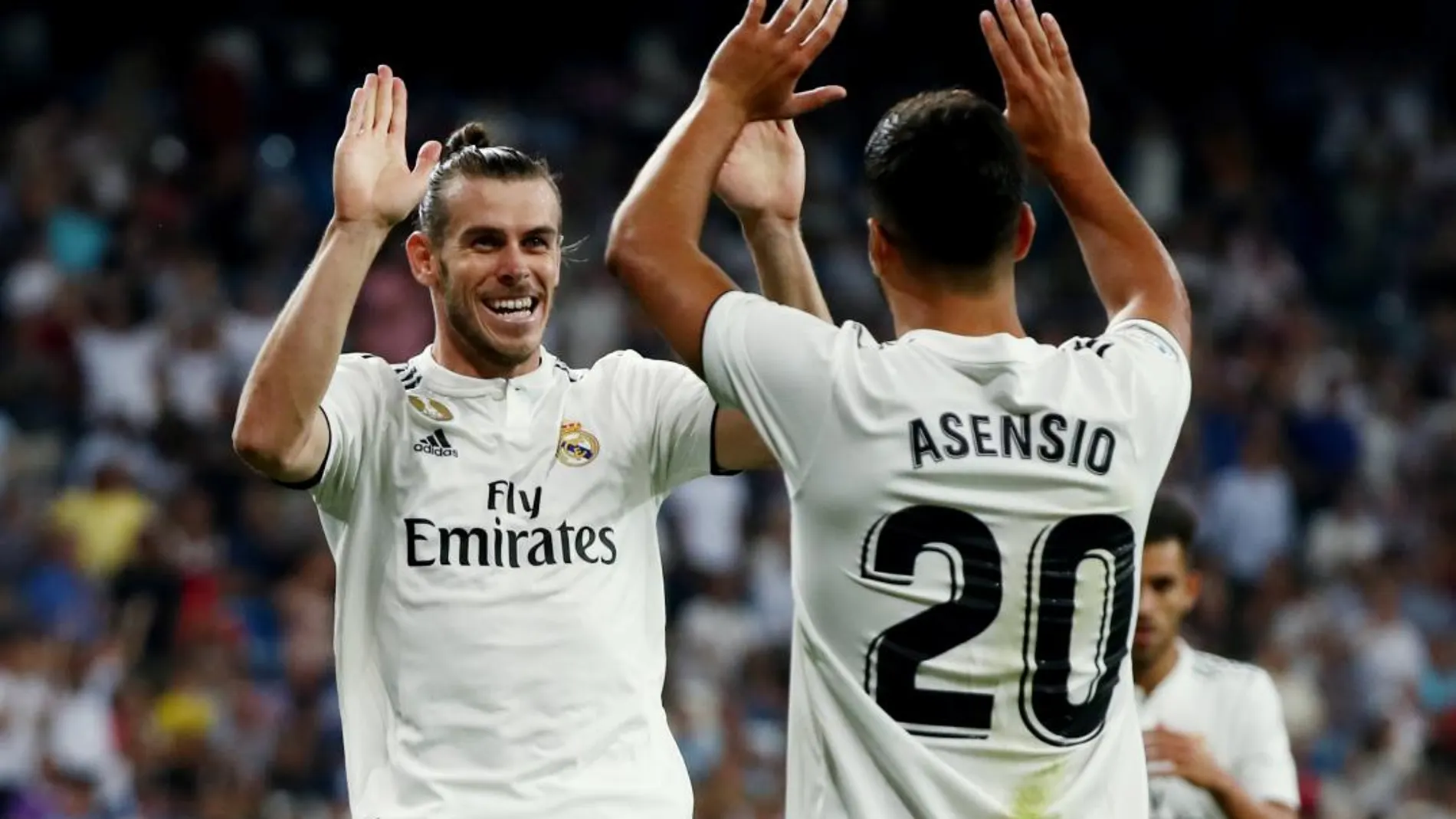 Bale y Asensio celebra uno de los goles anotados ante el Getafe / Reuters