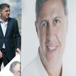 García Albiol, junto a su cartel electoral, que llamaba a «plantar cara» a los que quieren «romper la convivencia»
