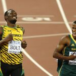 Usain Bol y Anaso Jobodwanaen la semifinal de 200m