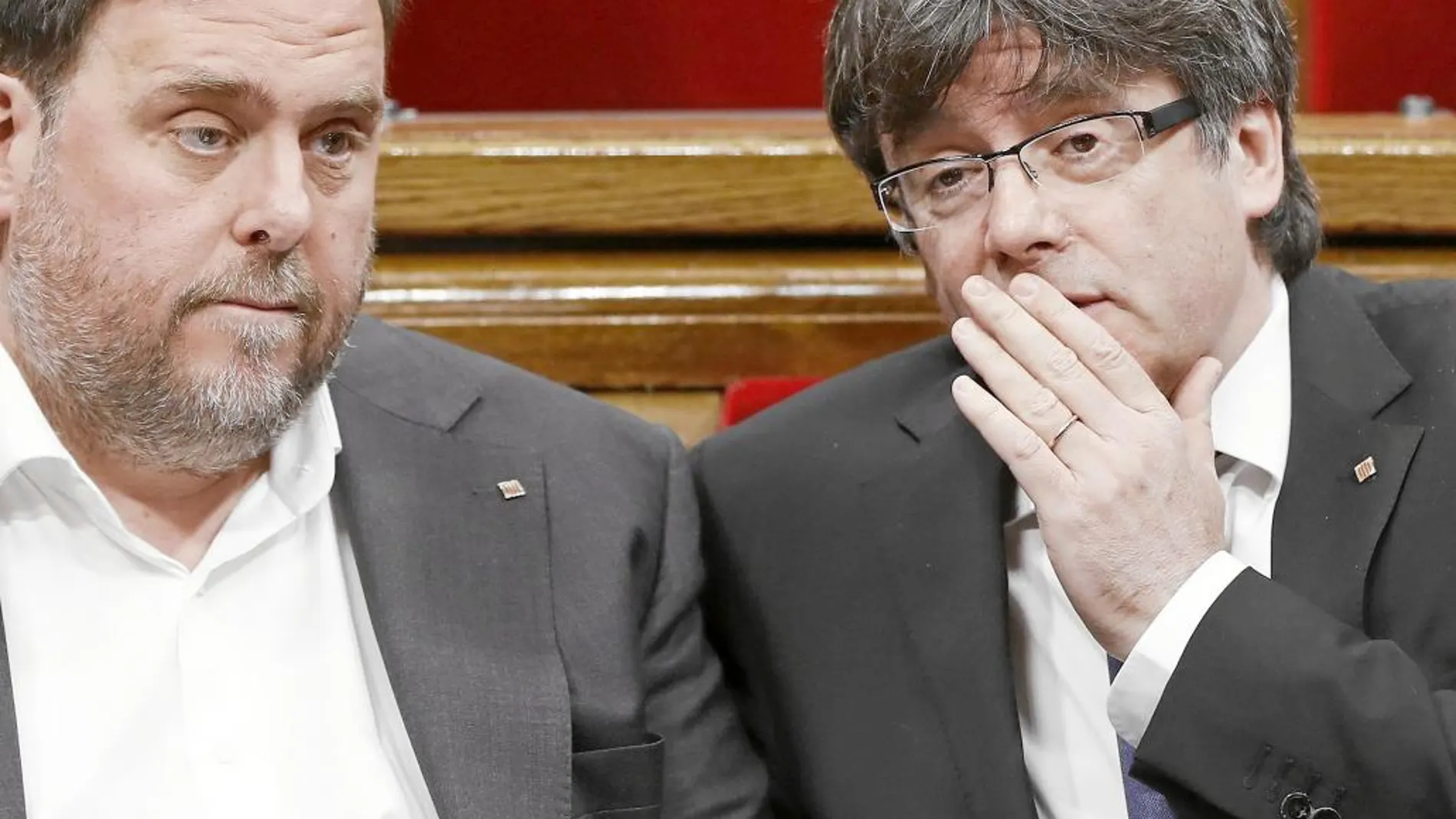 En la imagen, el president de la Generalitat, Carles Puigdemont, y el vicepresident, Oriol Junqueras.