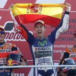 Jorge Lorenzo celebra el triunfo con Marquez y Pedrosa