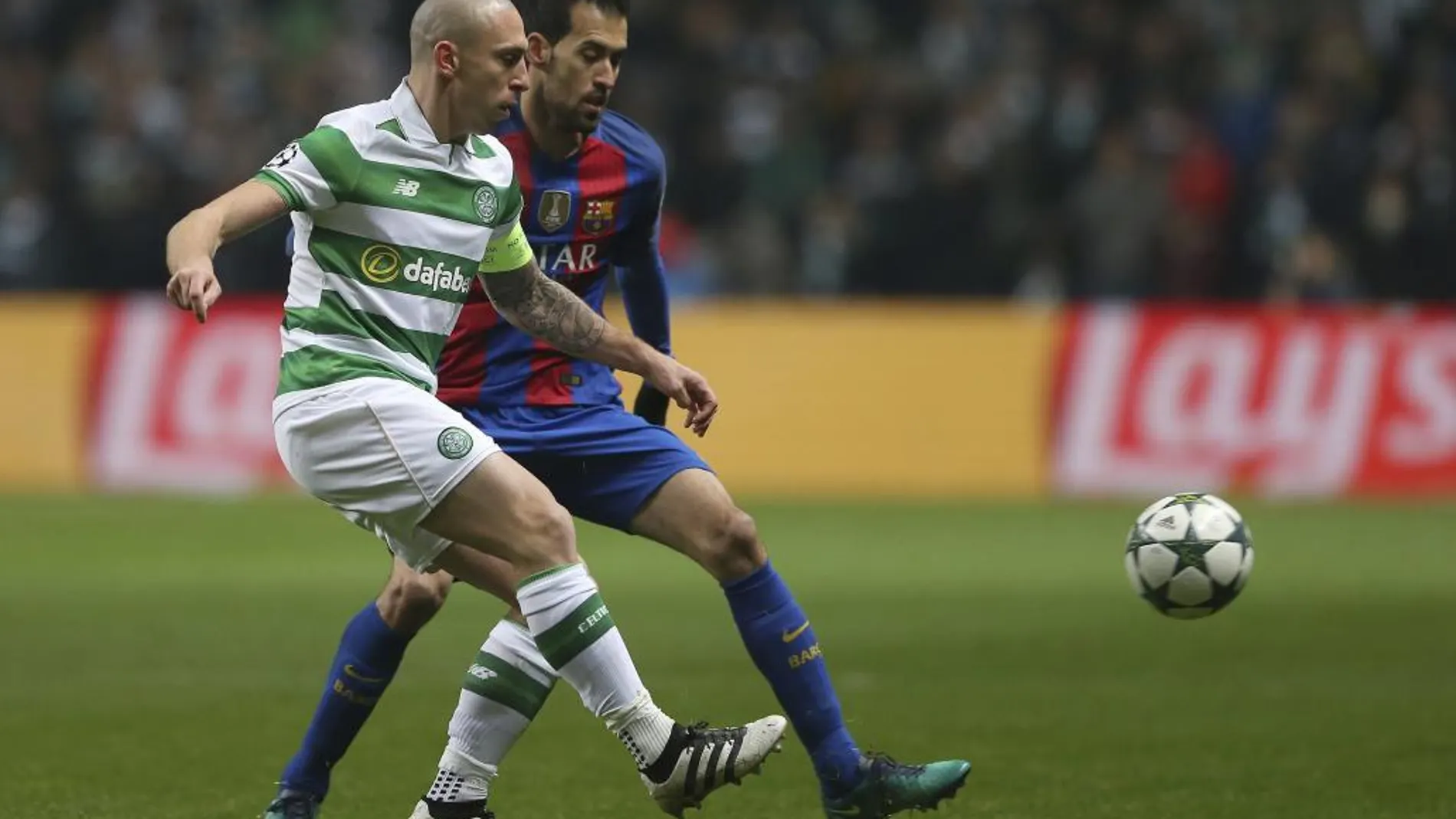 Scott Brown y Sergio Busquets