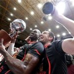 Los jugadores del Valencia Basket, Romain Sato y Rafa Martínez celebran el título de campeones de la Liga ACB
