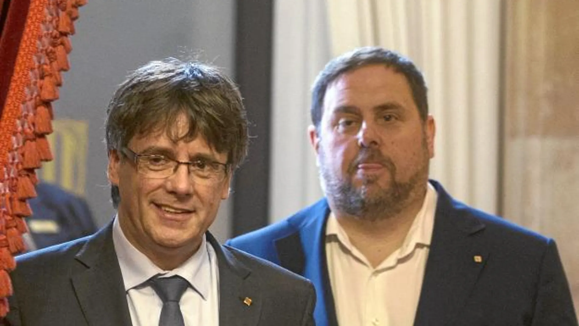 Puigdemont y Junqueras dirigiéndose a la sesión de control en el Parlament el pasado miércoles 12 de julio