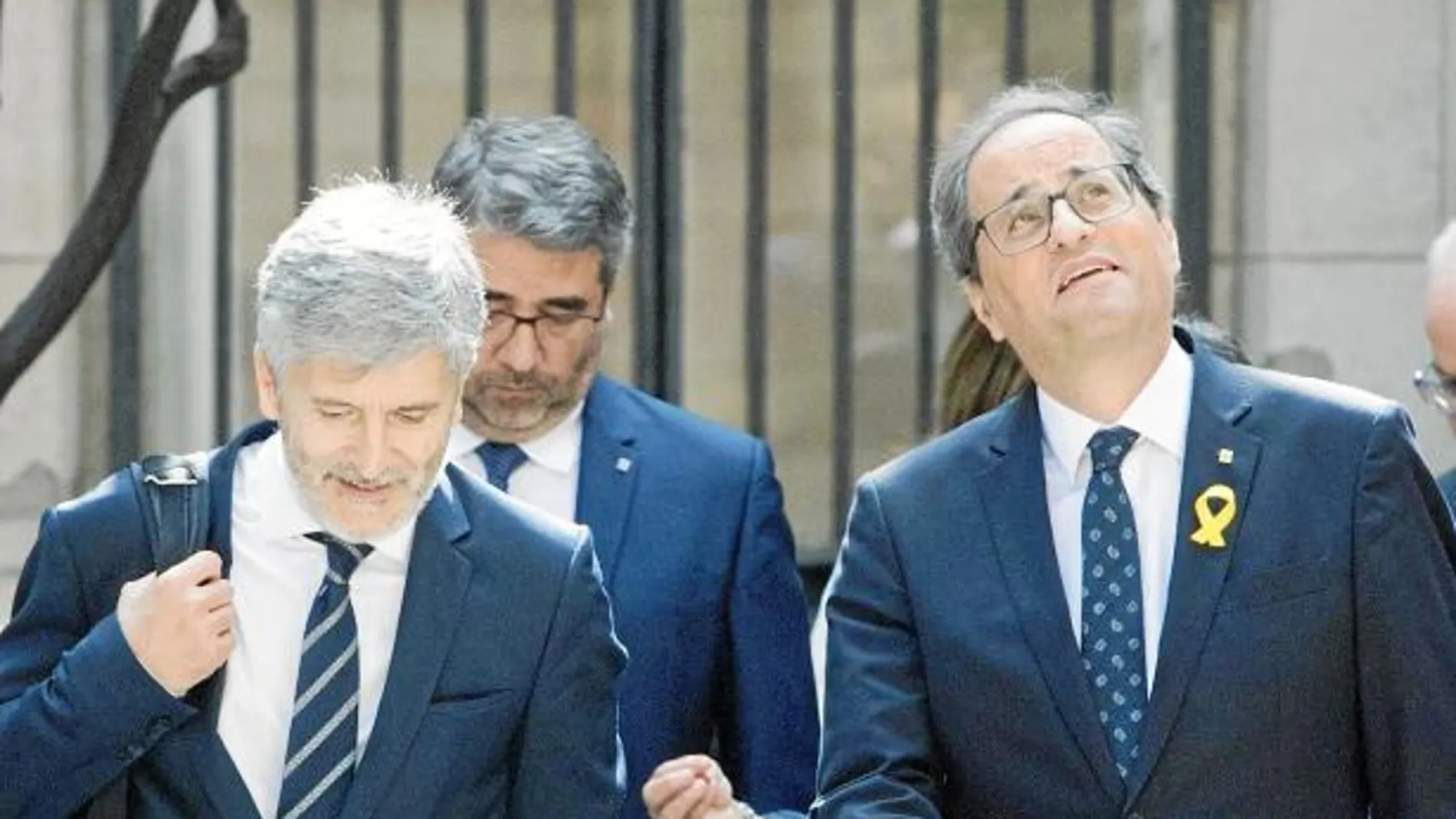 Marlaska y Torra, ayer, a la entrada de la Junta de Seguridad celebrada en Bracelona / Efe