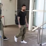 Leo Messi y Luis Suárez en el aeropuerto de El Prat