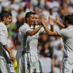 Cristiano celebra con sus compañeros su gol contra el Osasuna