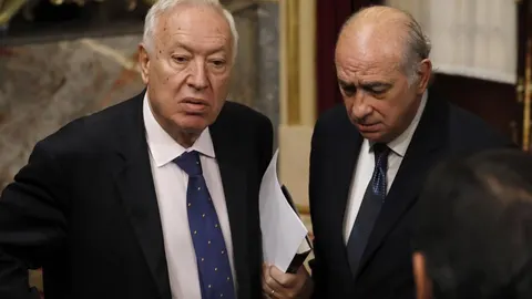 Los exministros de Asuntos Exteriores y de Cooperación José Manuel García-Margallo (i),y del Interior Jorge Fernández Díaz.