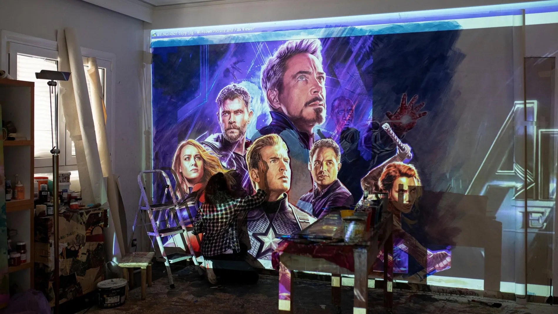 Greek artist Virginia Axioti works on the billboard of the "Avengers: Endgame"movie in Athens,