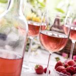 Rose wine on a picnic table.