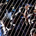 Inmigrantes subsaharianos en Ceuta tras un salto masivo a la valla fronteriza. Efe