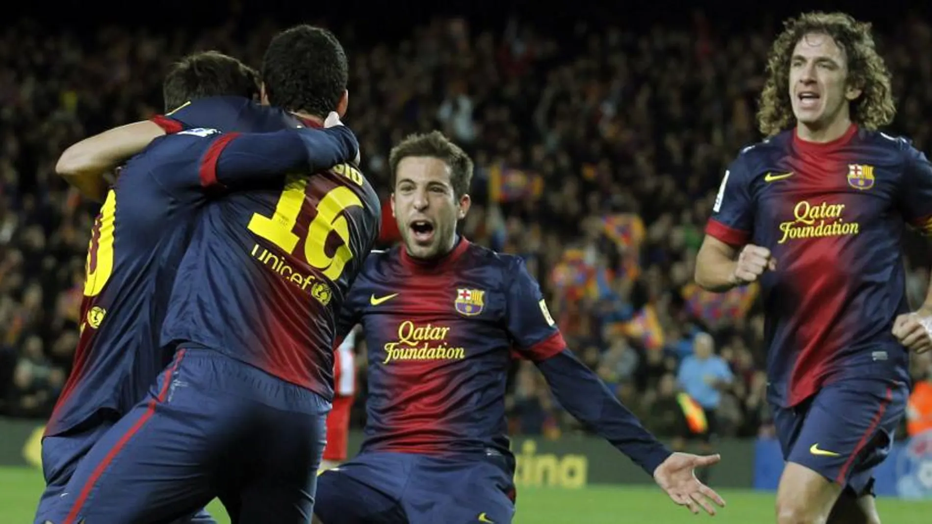 Busquet, Messi, alba y Pujol celebran un gol