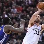 Toronto Raptors centre Marc Gasol (33) shoots over Golden State Warriors forward Draymond Green