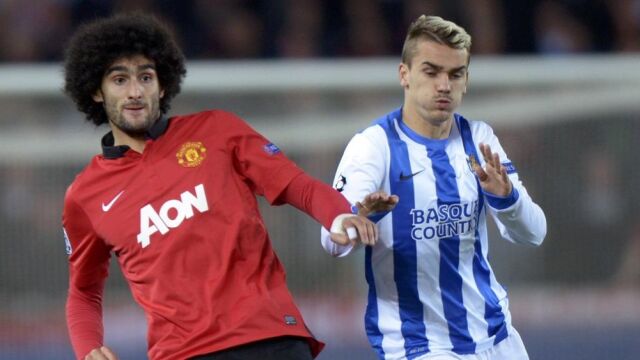 El jugador de la Real Sociedad, Antoine Griezma y el del Manchester United, Marouane Fellaini