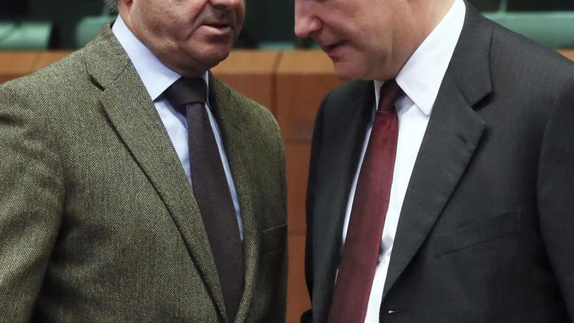 El ministro de Economía, Luis De Guindos junto al comisario Olli Rehn