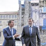 Alberto Núñez Feijóo y Mariano Rajoy, ayer, en Santiago de Compostela