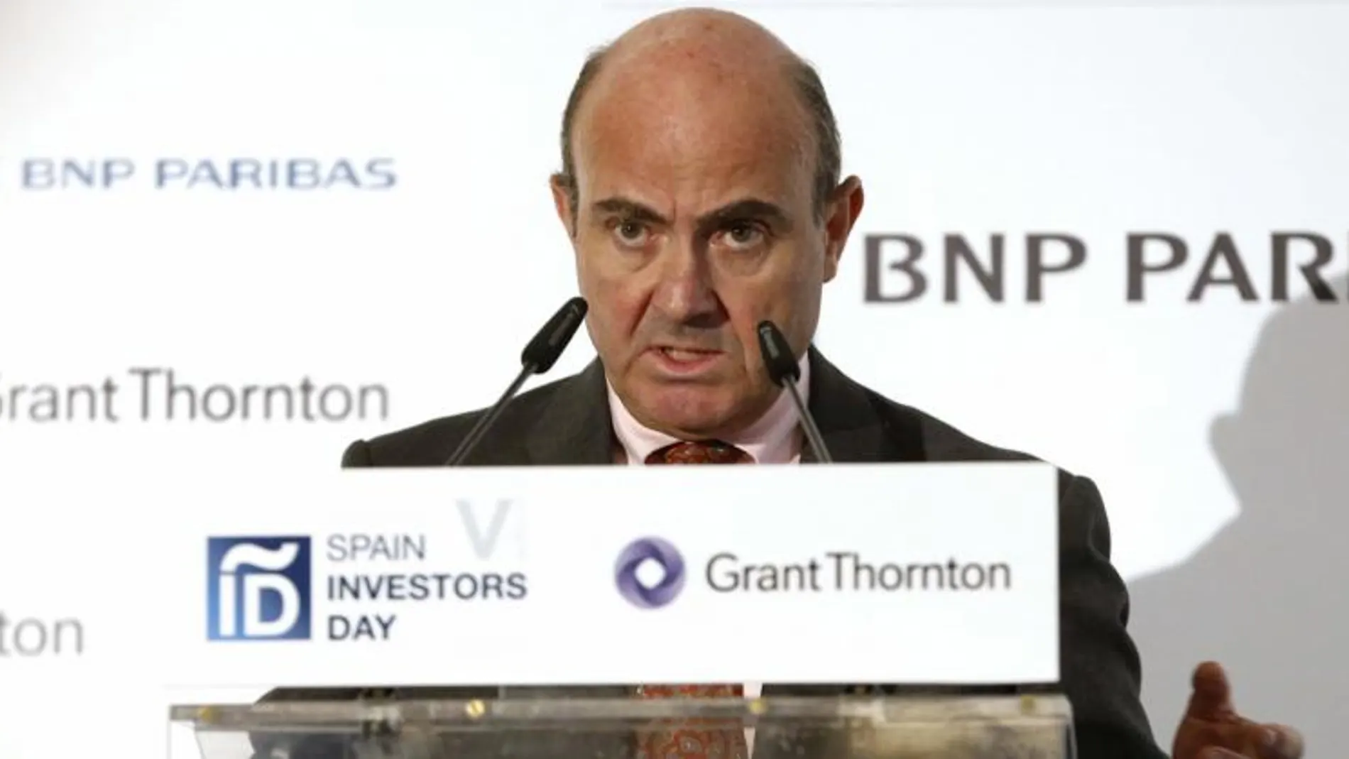 El ministro de Economía, Luis de Guindos, durante su intervención en el foro financiero Spain Investors Day (SID), en Madrid.