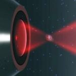 Ilustración de una nanopartícula atrapada por un láser