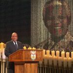 South African President Jacob Zuma sings during the funeral of former South African President Nelson Mandela in his ancestral village of Qunu in the Eastern Cape province, 900 km (559 miles) south of Johannesburg, in this still image taken from December 15, 2013 video courtesy of the South Africa Broadcasting Corporation (SABC). REUTERS/SABC via Reuters TV (SOUTH AFRICA - Tags: POLITICS OBITUARY TPX IMAGES OF THE DAY) ATTENTION EDITORS - FOR EDITORIAL USE ONLY. NOT FOR SALE FOR MARKETING OR ADVERTISING CAMPAIGNS. NO SALES. NO ARCHIVES. SOUTH AFRICA OUT. NO COMMERCIAL OR EDITORIAL SALES IN SOUTH AFRICA. THIS PICTURE WAS PROCESSED BY REUTERS TO ENHANCE QUALITY