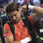 El tenista español David Ferrer reacciona al ser derrotado por el japonés Kei Nishikori