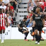 Los jugadores del Málaga celebran el primer gol ante el Almería