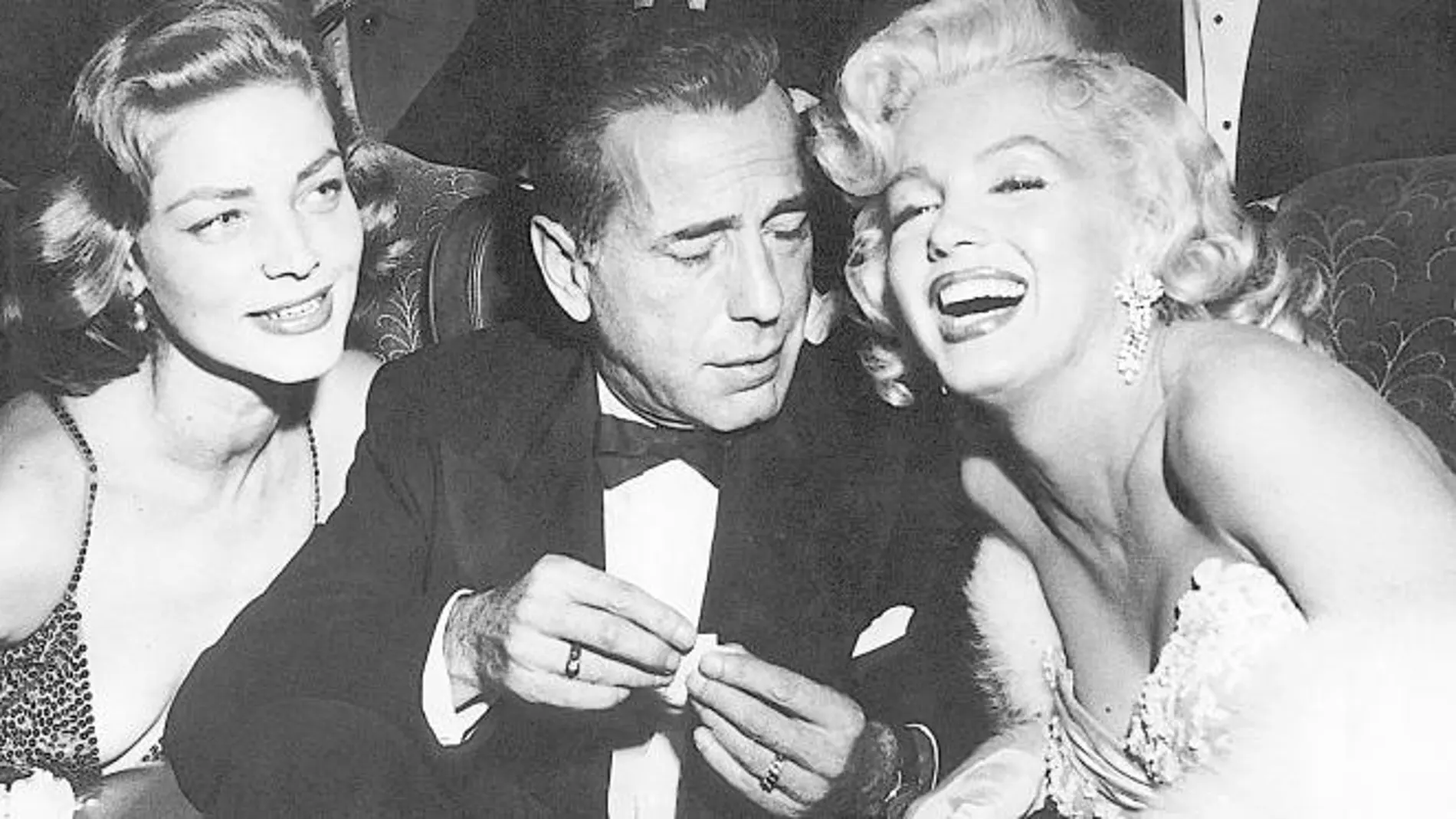 Bacall, Bogart y Monroe durante el estreno de "Cómo casarse con un millonario", en 1953