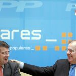 El presidente del PP de Castilla y León, Juan Vicente Herrera, con su número 2, Alfonso Fernández Mañueco, en la sede autonómica