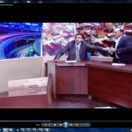 Un legislador jordano amenaza a su adversario con un arma en un debate televisivo
