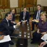 Rajoy en el encuentro que ha mantenido con la canciller alemana Angela Merkel, esta tarde en Bucarest