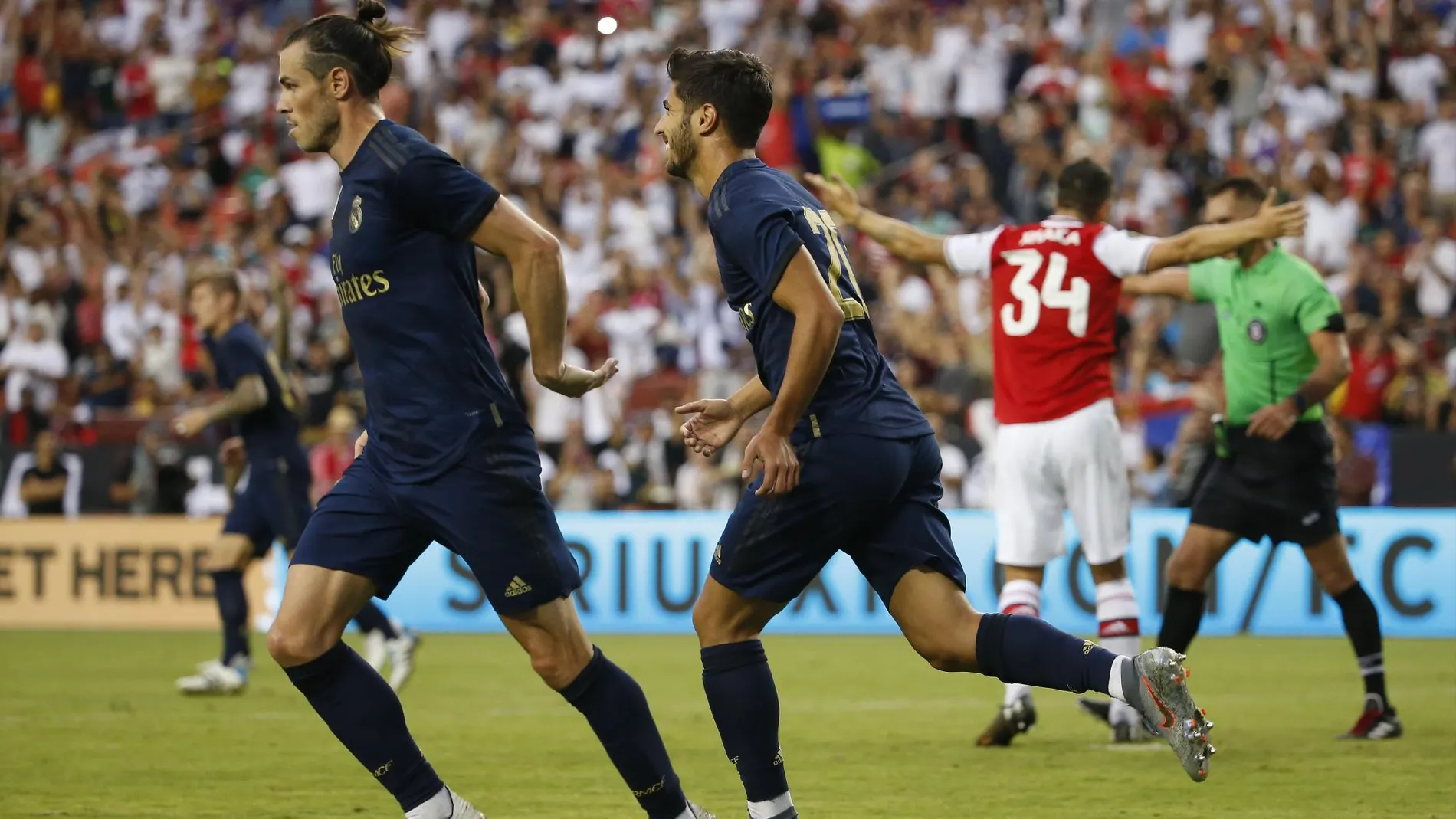 Asensio celebra el gol que marcó al Arsenal con Gareth Bale