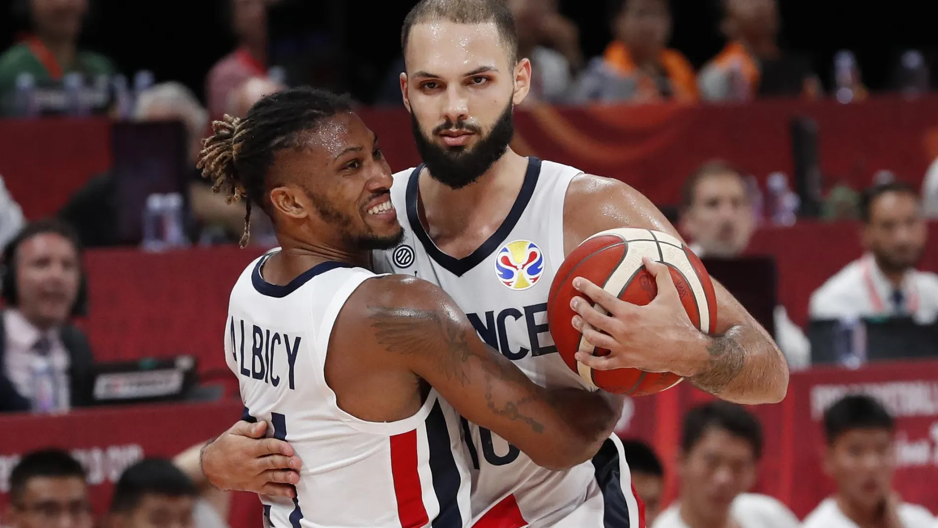 [China - September 15, 2019 France's Andrew Albicy and Evan Fournier celebrate victory after the match]