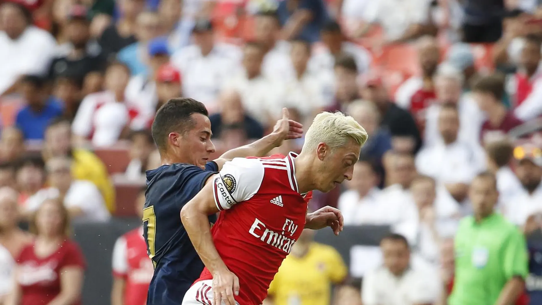 [Mesut Ozil (10) battle for the ball during the first half of a match in the International Champions Cup]