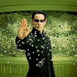 Neo detiene las balas que le dispara el agente Smith. Una de las imágenes más reconocidas de la primera película de «The Matrix»