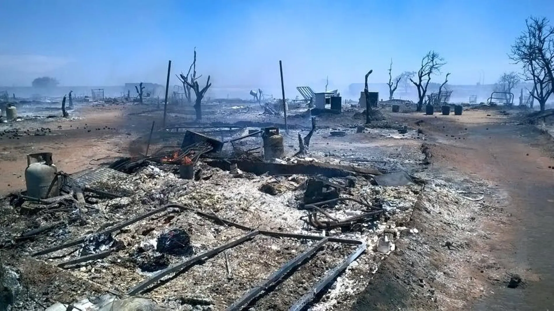 Foto de archivo del asentamiento de Lepe afectado por un incendio / EP