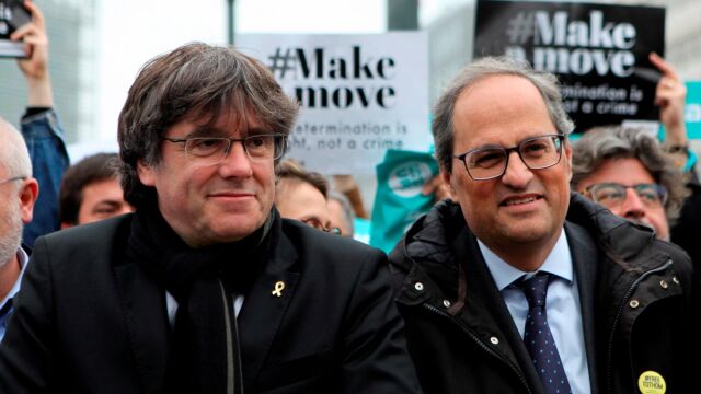 Carles Puigdemont y Quim Torra en un acto de protesta en Bélgica