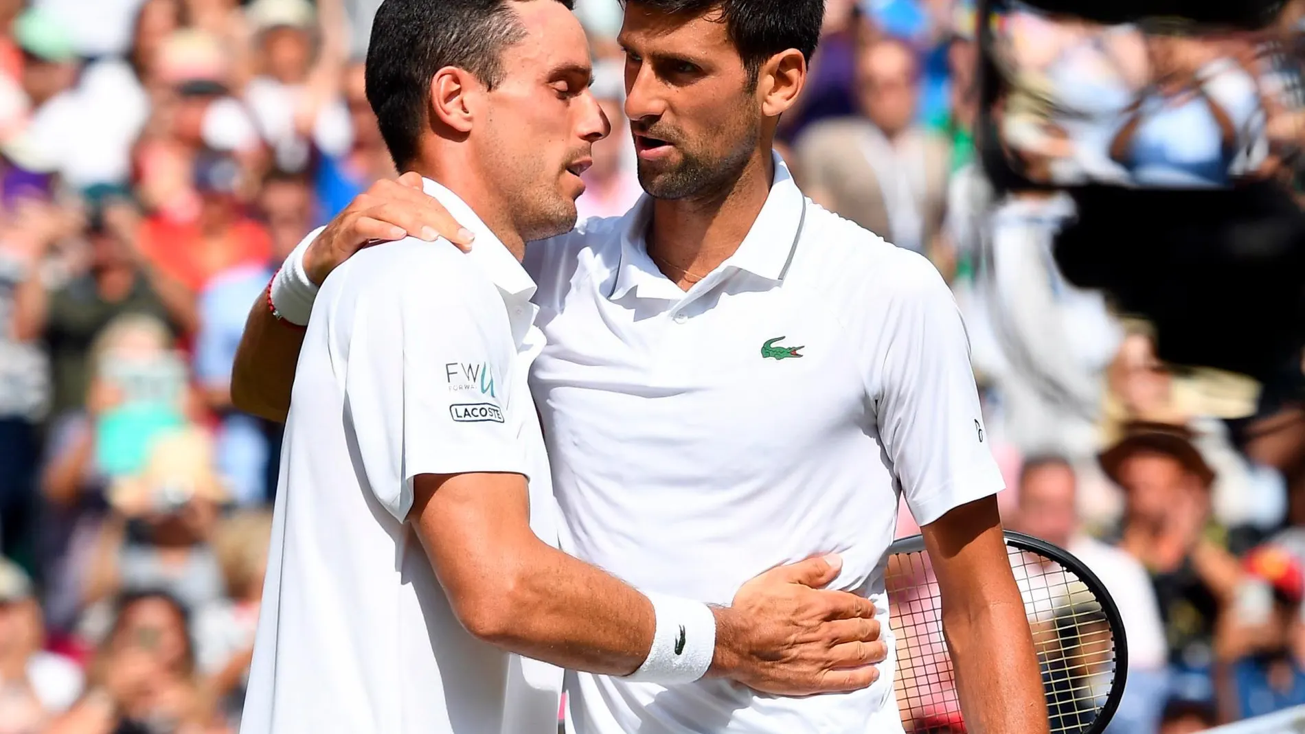 Novak Djokovic y Roberto Bautista Agut tras el partido.
