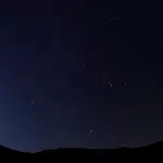 Meteors of the Orionid Meteor Shower streak through the night sky above the San Rafael Swell