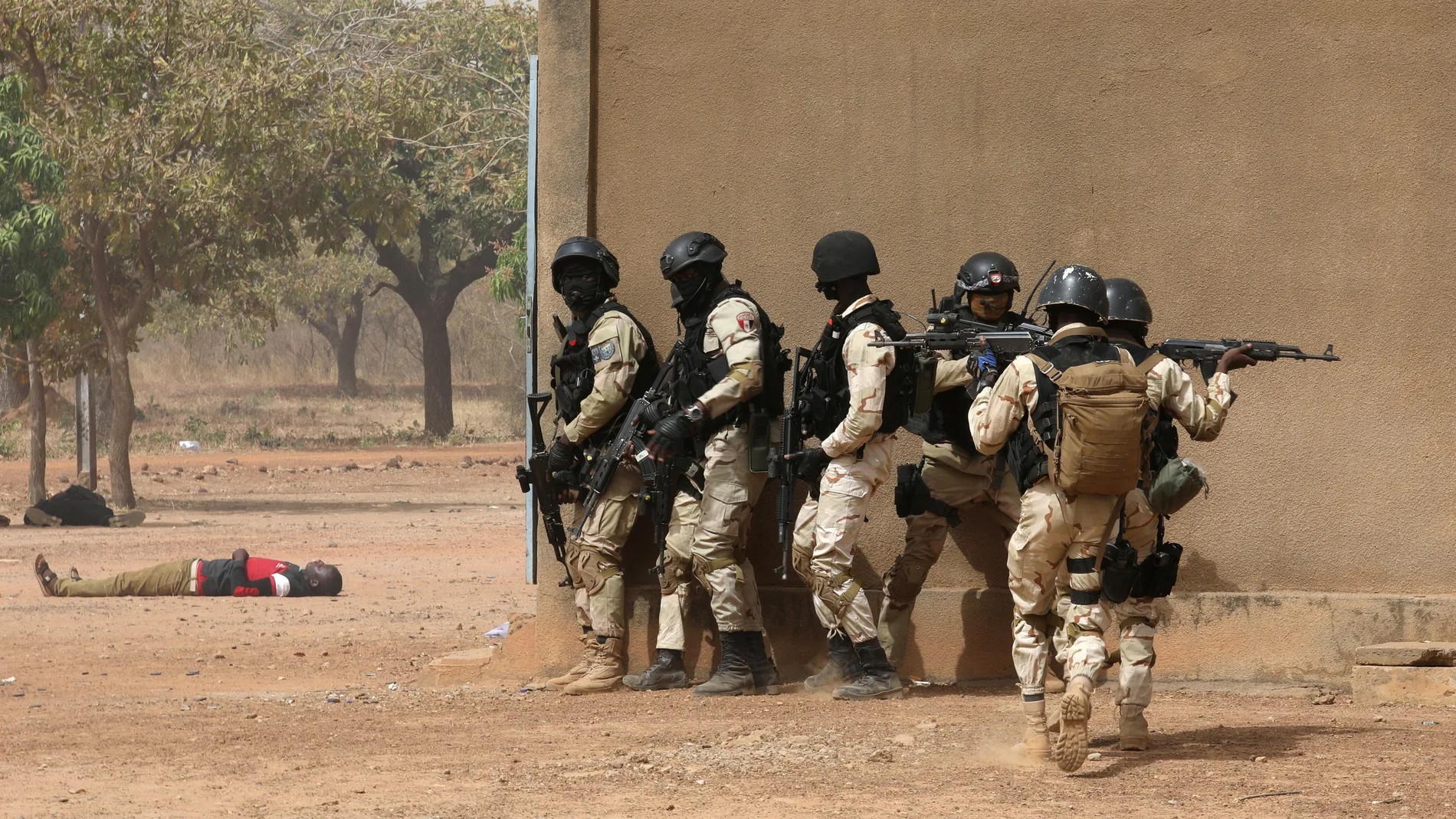 Soldiers from Burkina Faso participate in a simulated raid during the U.S. sponsored Flintlock exercises in Ouagadougou, Burkina Faso