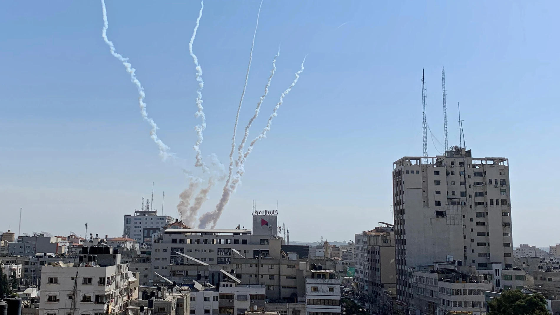 Trails of smoke are seen as rockets are fired from Gaza towards Israel, in Gaza