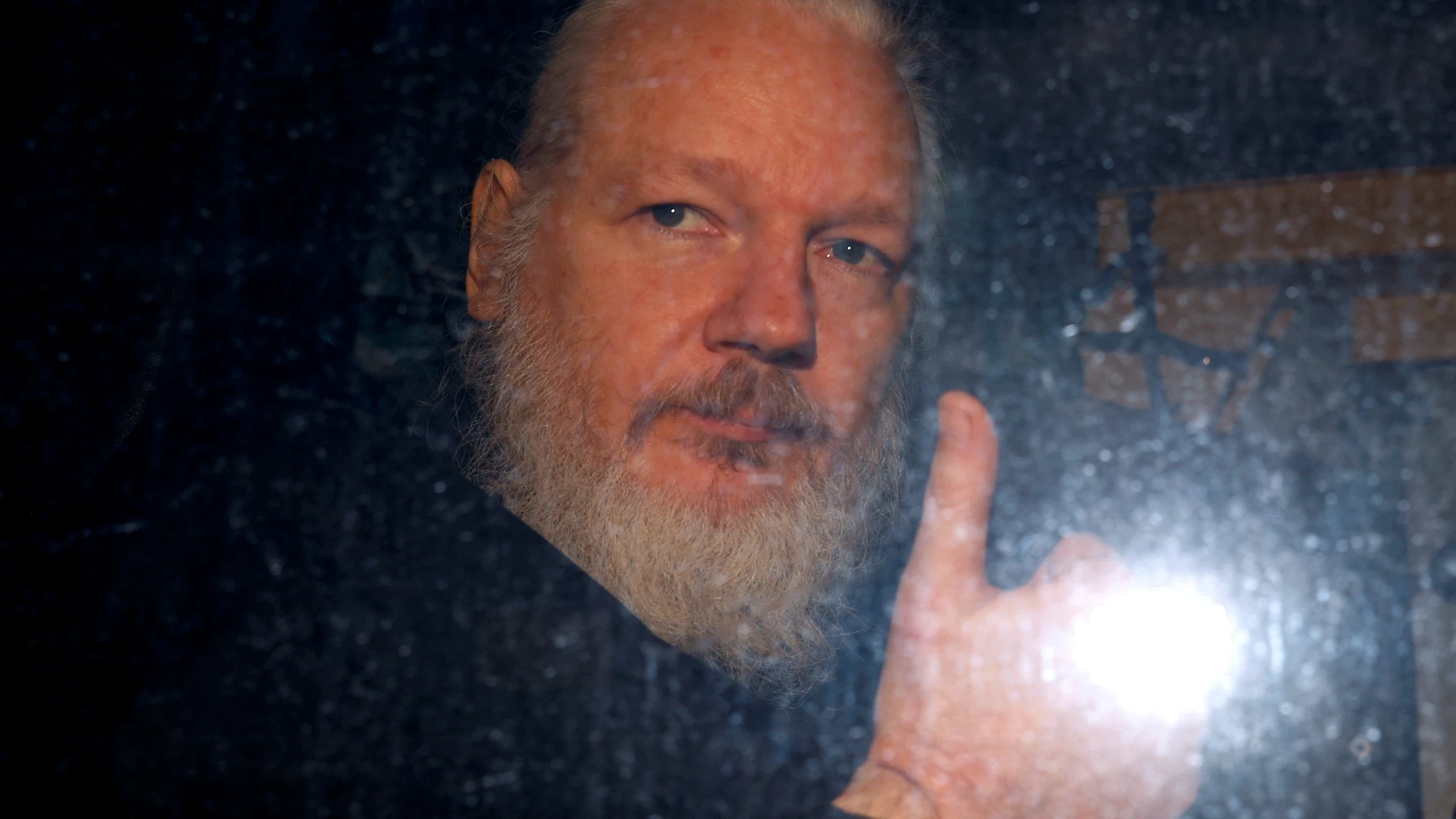 FILE PHOTO: WikiLeaks founder Julian Assange is seen as he leaves a police station in London