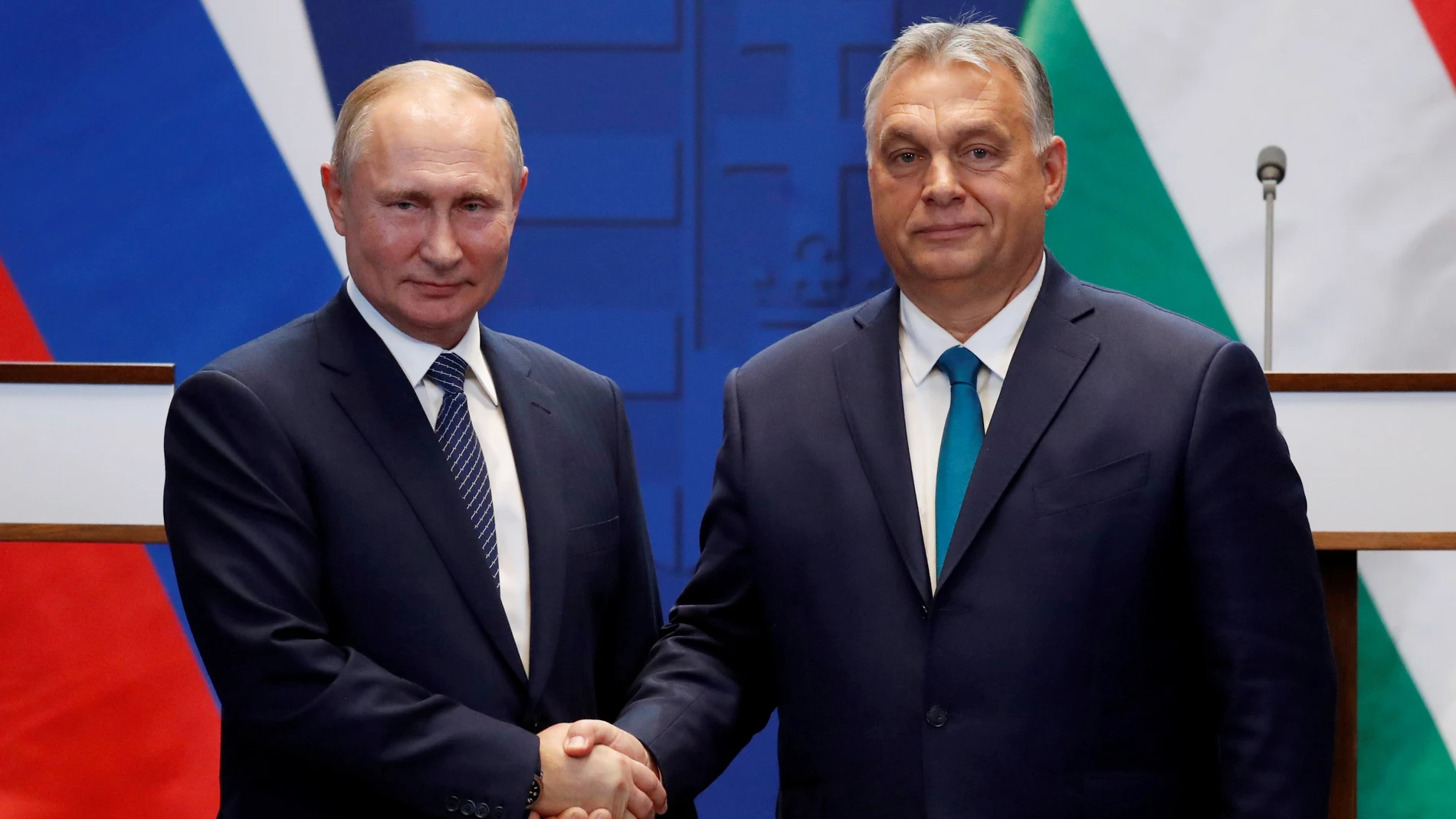 FILE PHOTO: Hungarian Prime Minister Viktor Orban and Russian President Vladimir Putin attend a news conference following their talks in Budapest
