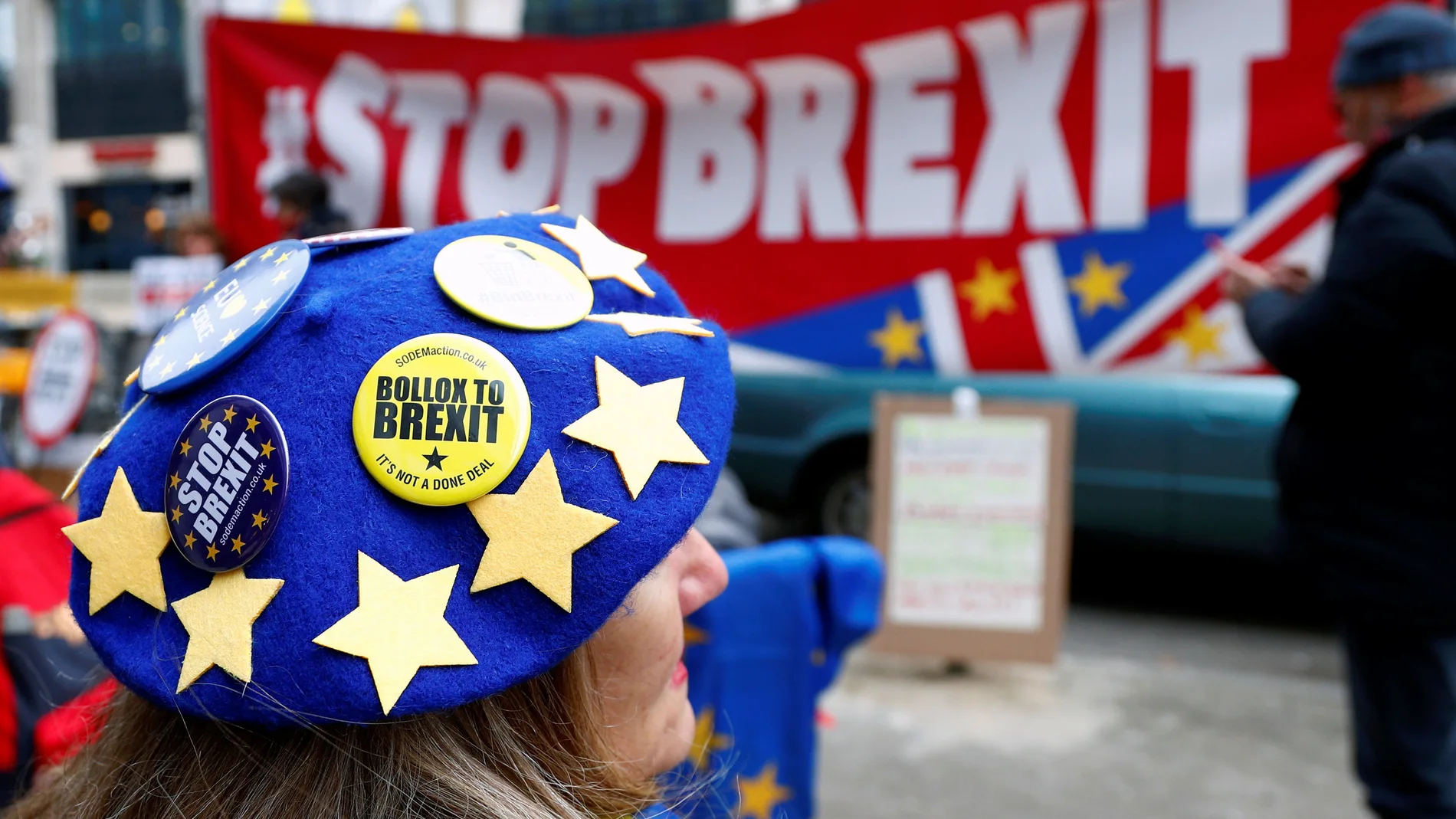 Anti-Brexit badges on a protester's beret are pictured during a demonstration in front of the British embassy in Brussels