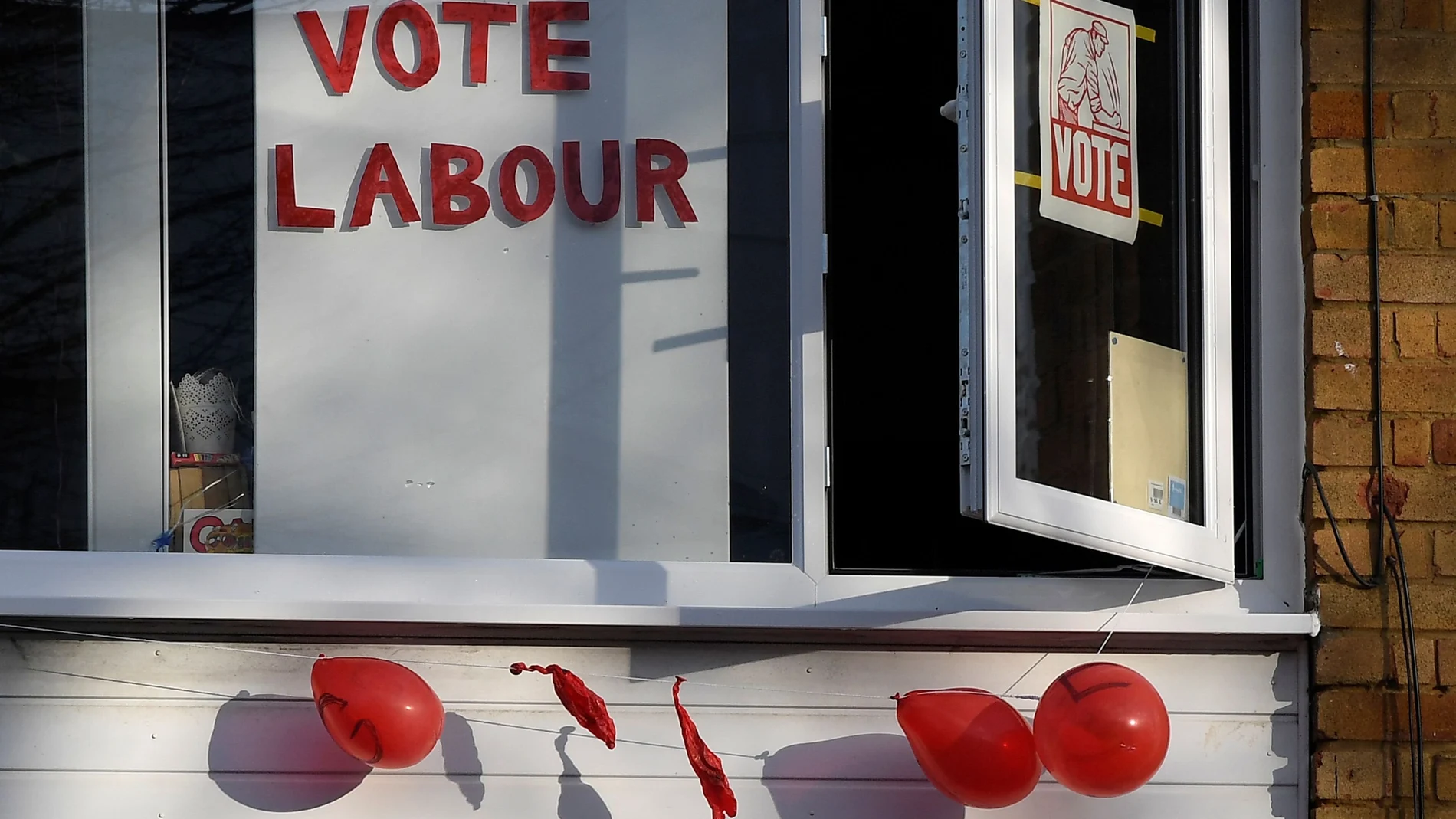 Political election campaign messages and burst balloons are seen at a house in the same street where Labour party leader Jeremy Corbyn lives, London, Britain