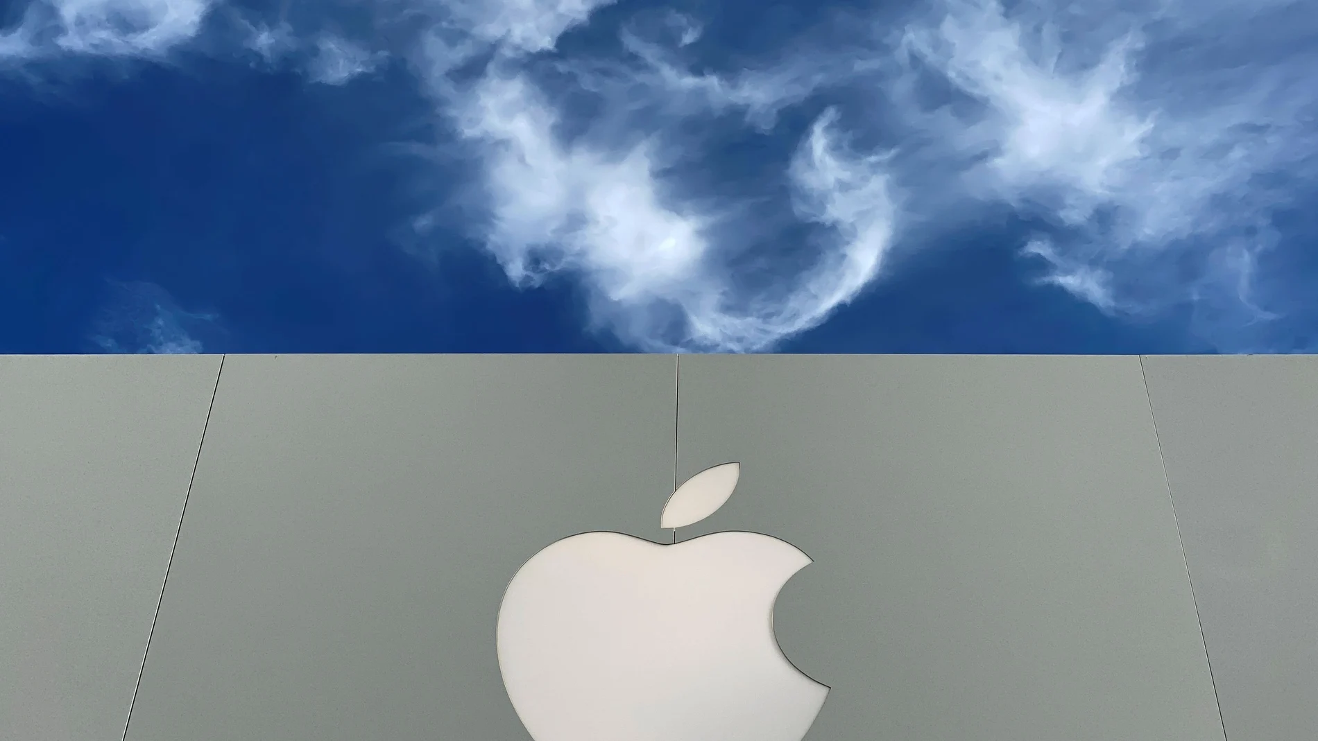 The Apple logo is shown atop an Apple store at a shopping mall in La Jolla, California