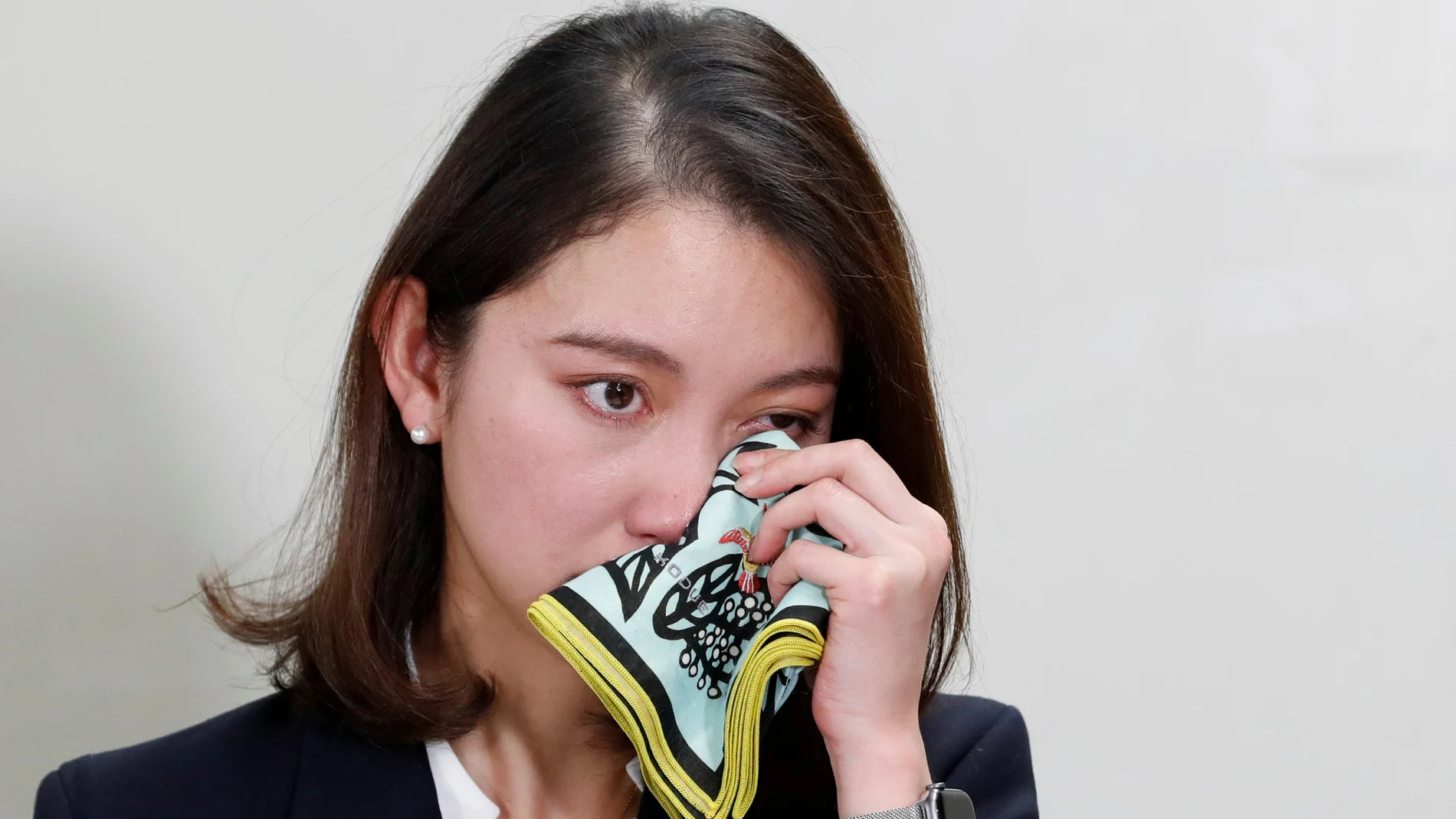 Japanese freelance journalist Shiori Ito sweeps the tears during her news conference after a court verdict in Tokyo