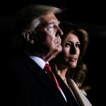 First lady Melania Trump looks on beside U.S. President Donald Trump as they attend a signing ceremony for the "National Defense Authorization Act for Fiscal Year 2020" at Joint Base Andrews, Maryland, U.S. December 20, 2019. REUTERS/Leah Millis